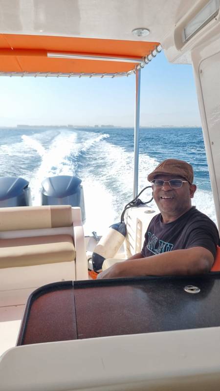 A person sitting on a boat

Description automatically generated